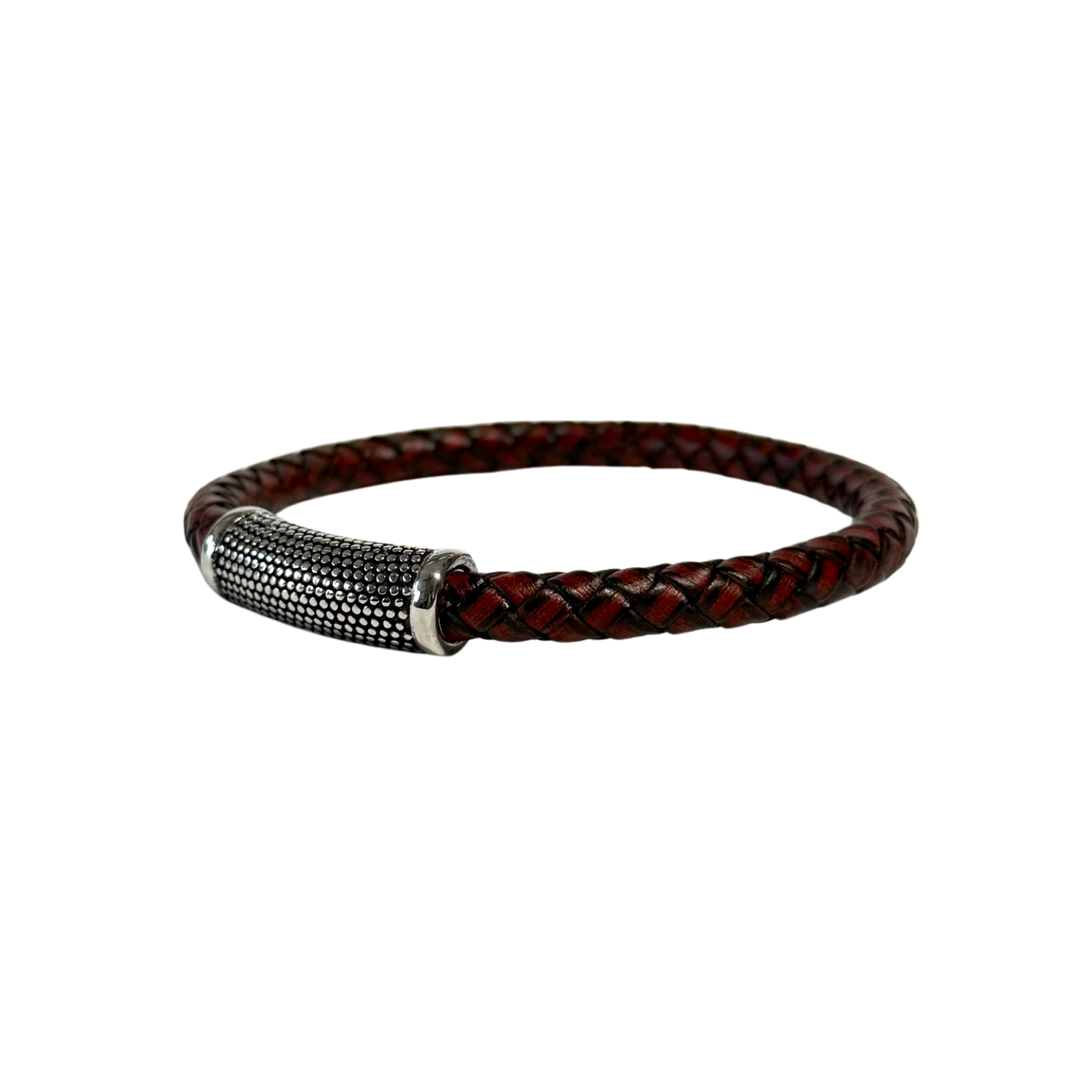 Brown braided leather bracelet with a silver clasp on a white background