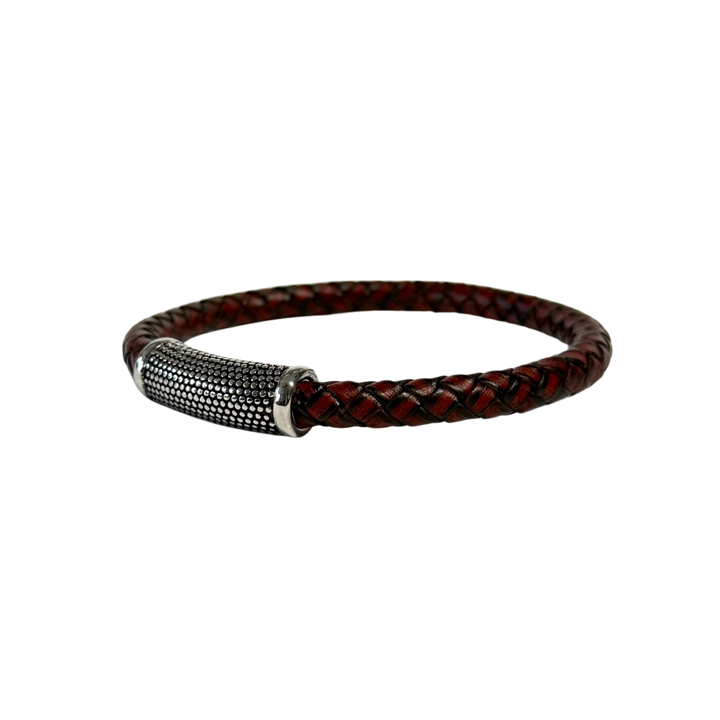 Brown braided leather bracelet with a silver clasp on a white background